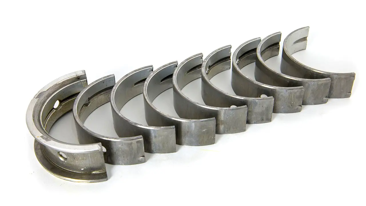 A complete set of worn crankshaft bearings.