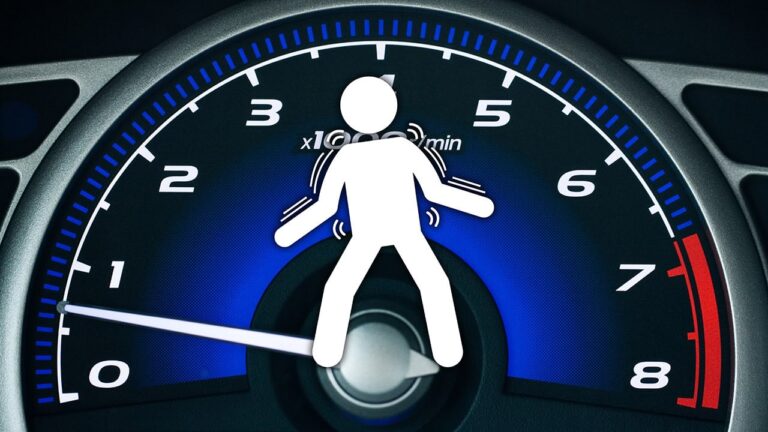 A tachometer at idle speeds with an illustration of someone rattling and shaking from vibrations overlayed on it.